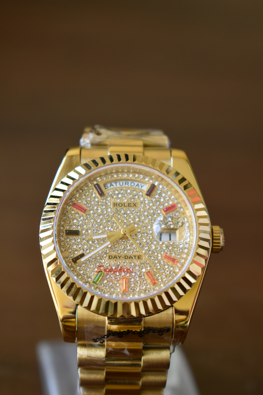 Rolex Day-Date 36 mm President Yellow Gold Diamond Paved Rainbow Colored Sapphires Dial 128238 for sale in Nairobi,Kenya.